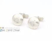 Zilveren (925) manchetknopen met UFO vorm waar een patroon in gewalst is